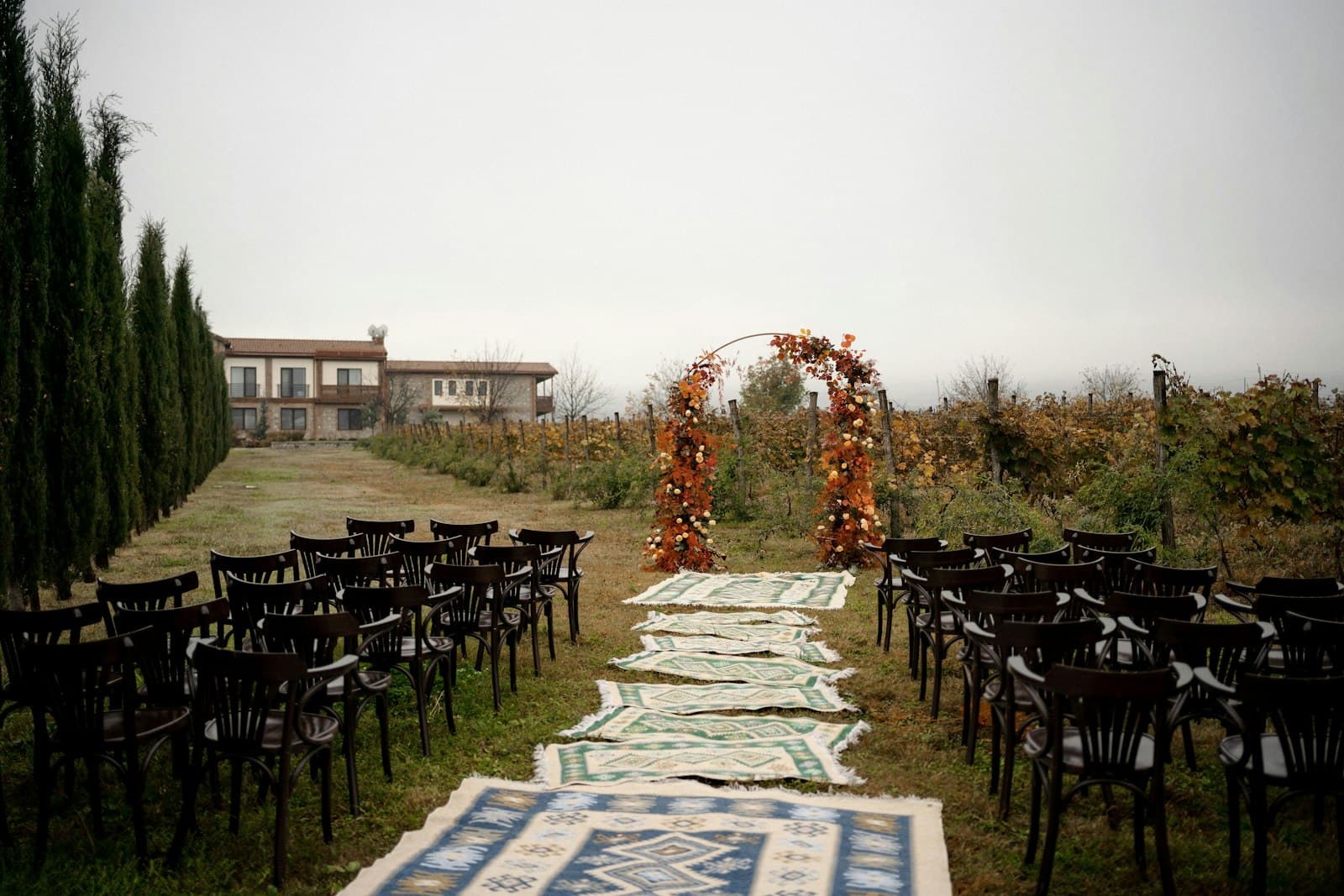An outdoor ceremony aisle set with chairs