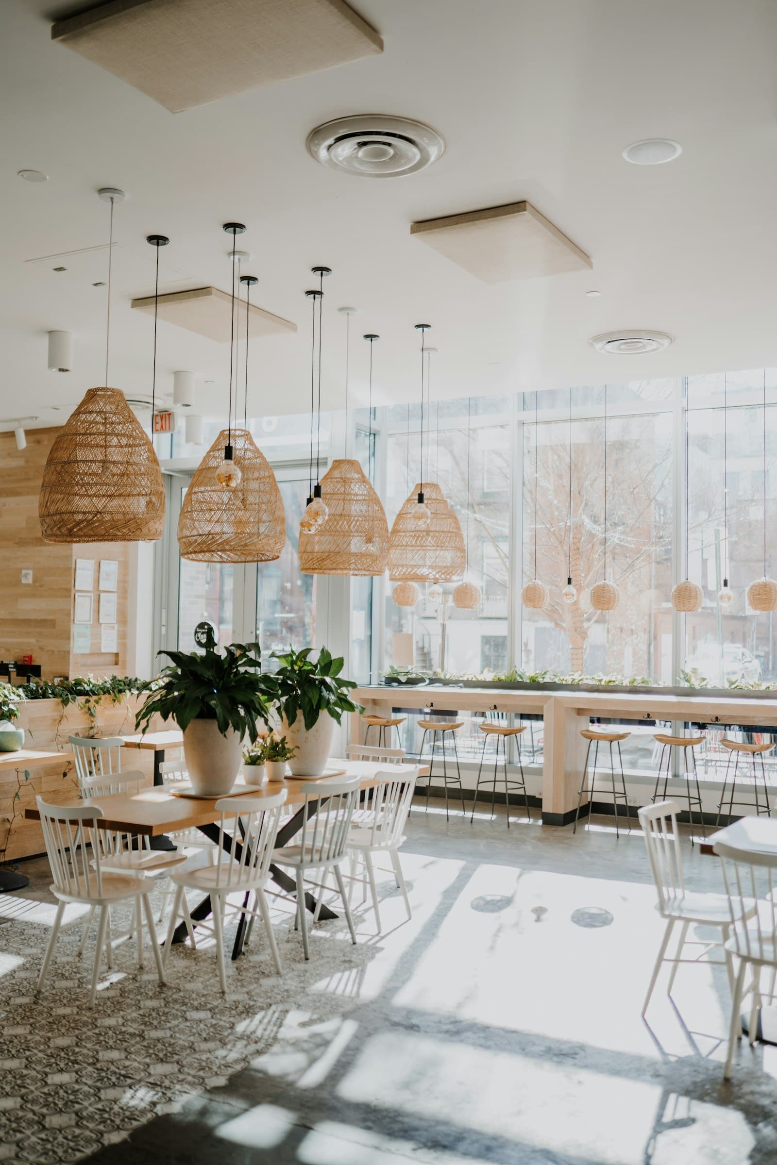 Dining room with woven pendant lights and daylight