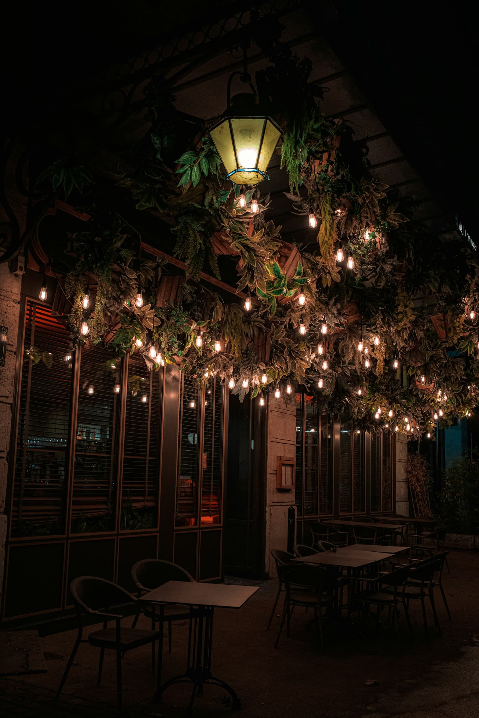 Outdoor patio strung with warm lights at dusk