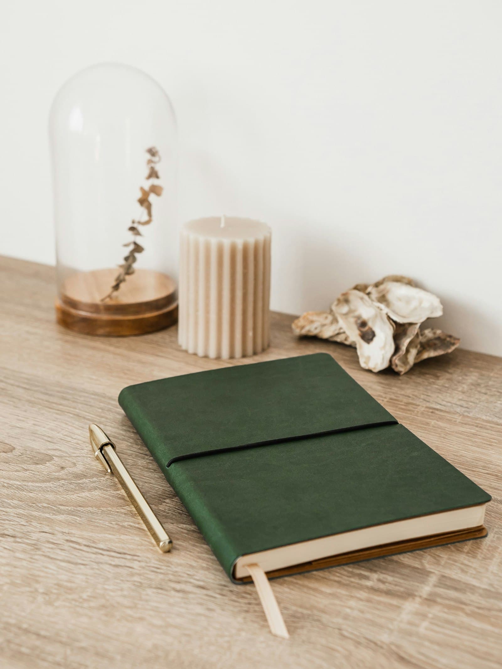 A leather-bound journal on a wooden desk