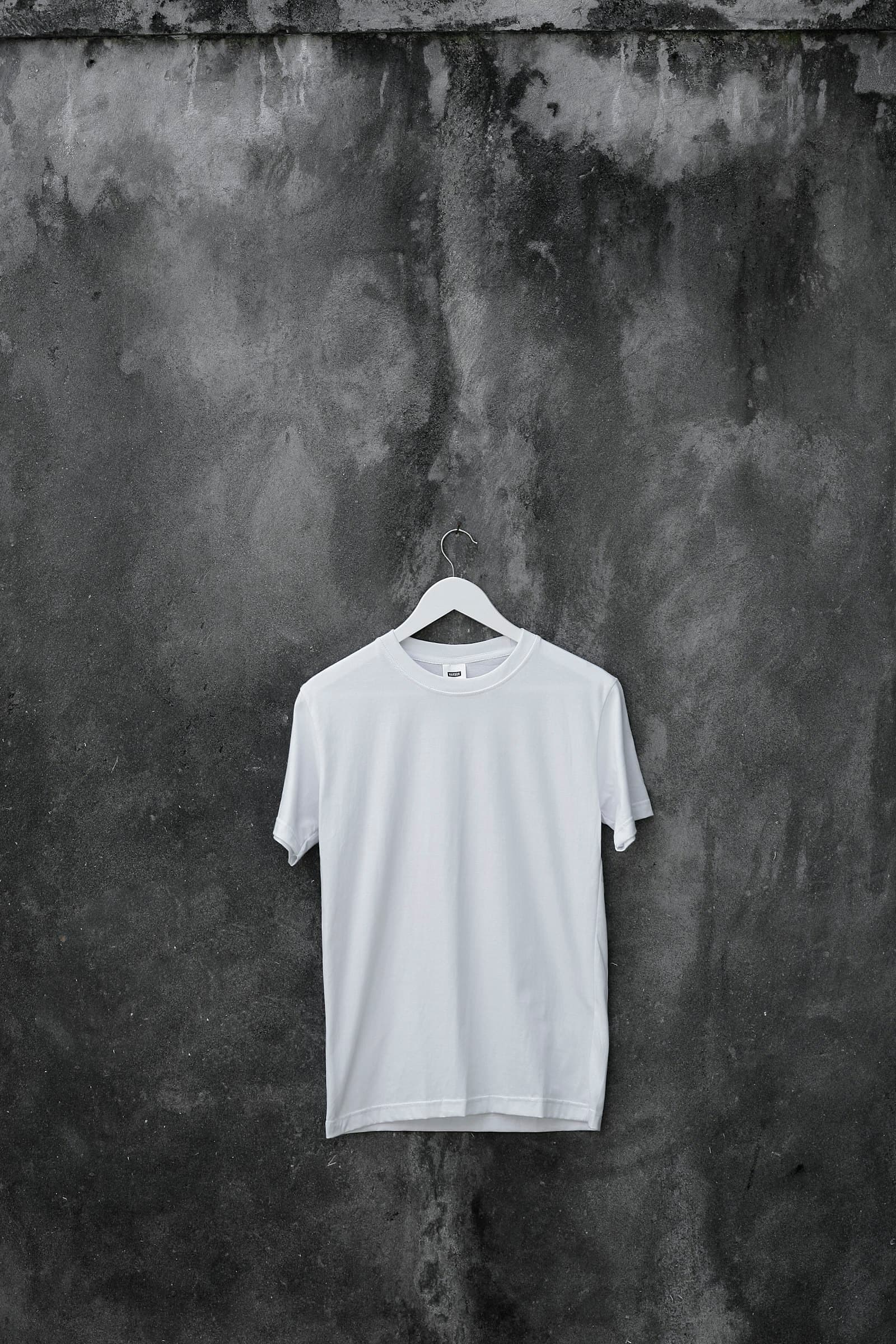 A plain cotton t-shirt on a hanger