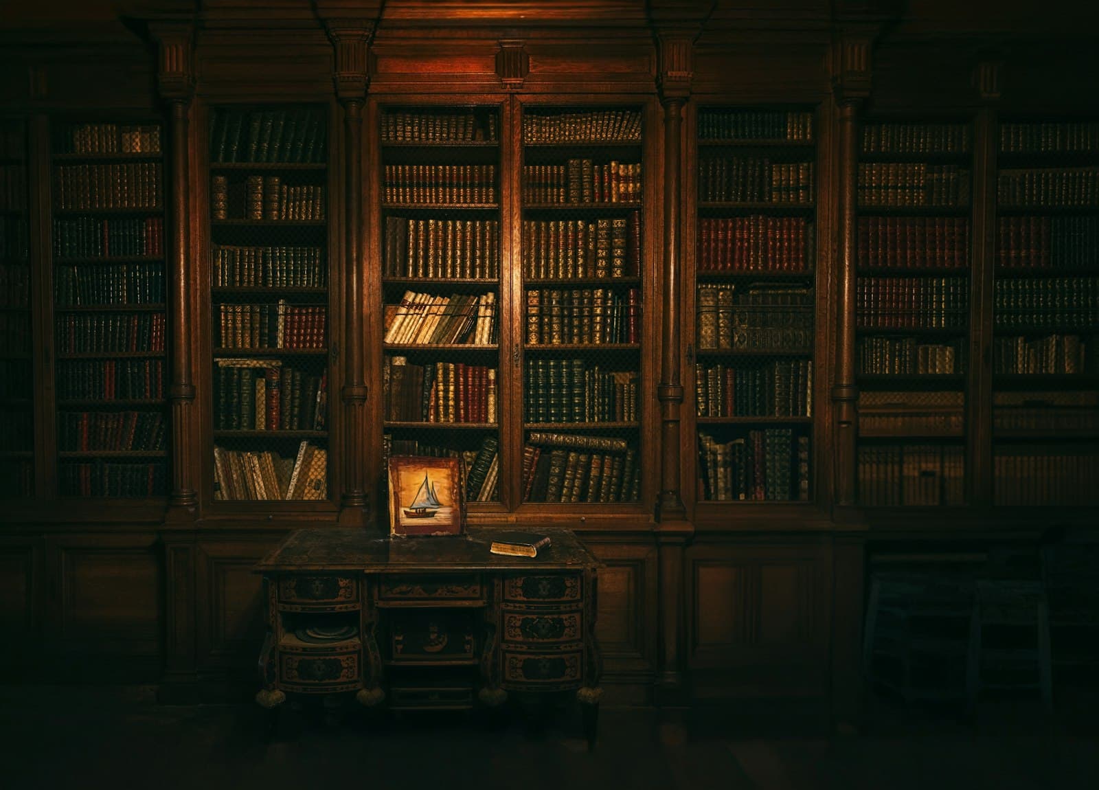 A wood-panelled library wall of bound volumes
