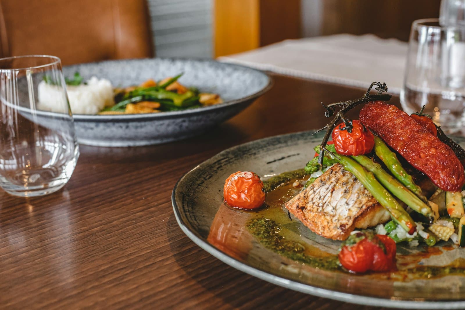 A plated main course on a wooden table