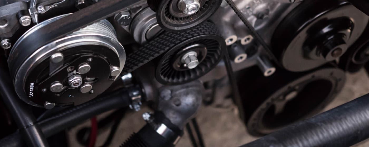Close-up of drive belt and pulleys on an engine