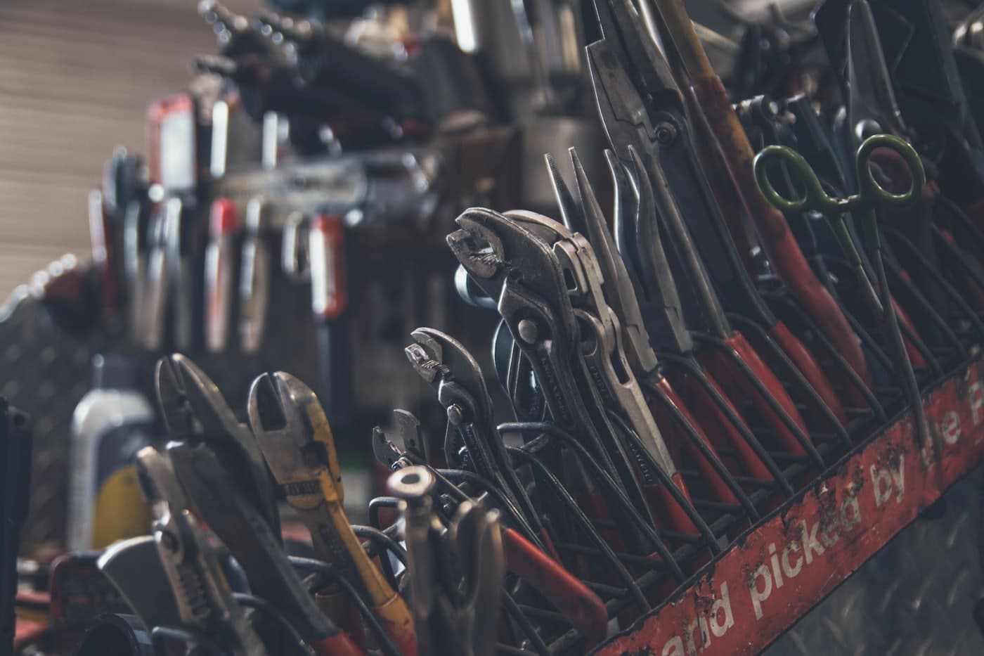 Rack of pliers and hand tools on the shop wall